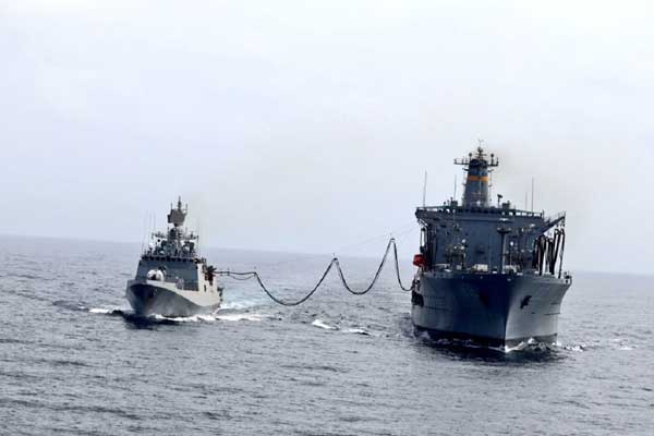 Indian Warship Undertakes Refueling With US Navy Fleet Tanker in Northern Arabian Sea