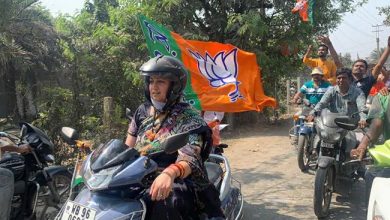 West Bengal : Union Minister Smriti Irani rides scooty during a roadshow in Panchpota
